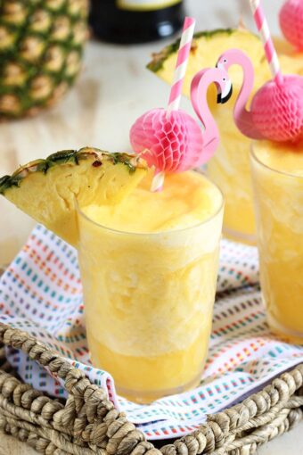 Two ingredients, one minutes, the perfect party cocktail...Pineapple Prosecco Slushies are the best beverage for summer! | TheSuburbanSoapbox.com