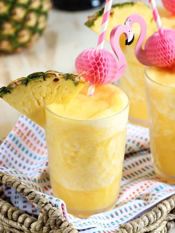 Two ingredients, one minutes, the perfect party cocktail...Pineapple Prosecco Slushies are the best beverage for summer! | TheSuburbanSoapbox.com