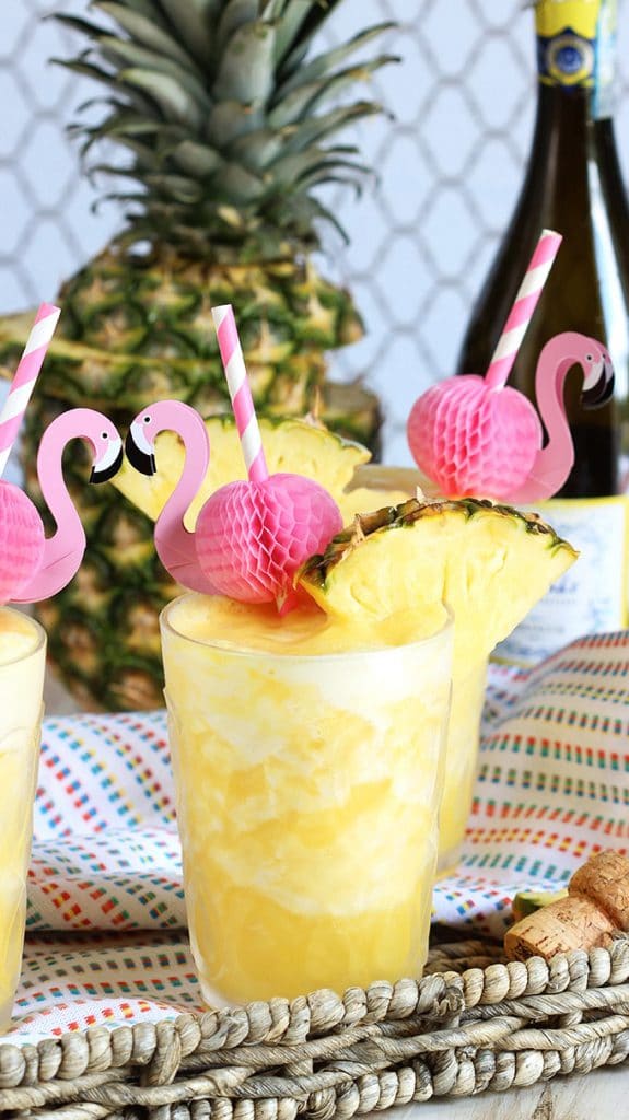 Two ingredients, one minutes, the perfect party cocktail...Pineapple Prosecco Slushie are the best beverage for summer! | TheSuburbanSoapbox.com