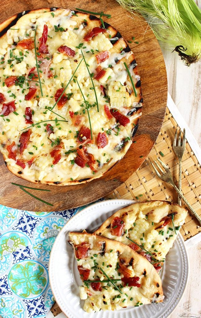 Easy and ready in minutes, this Grilled Corn Pizza with Bacon and Chives is summer's greatest gift! Great for tailgating! | TheSuburbanSoapbox.com