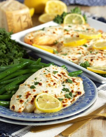Super easy and ready in just 15 minutes, this Flaky Parmesan Tilapia is a huge hit with the entire family. TheSuburbanSoapbox.com