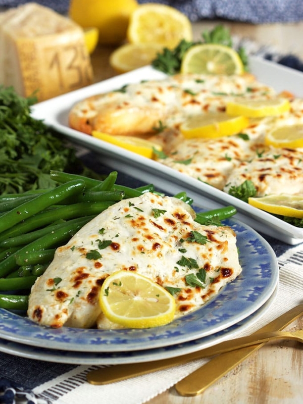 Super easy and ready in just 15 minutes, this Flaky Parmesan Tilapia is a huge hit with the entire family. TheSuburbanSoapbox.com