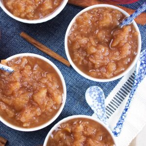Super easy to make Easy Slow Cooker Applesauce recipe is the BEST homemade treat for fall. A must make for the apple season. TheSuburbanSoapbox.com