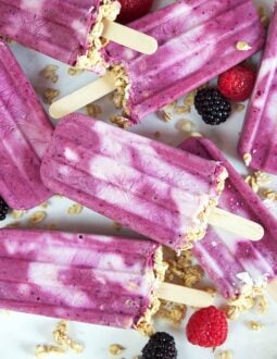 Easy to make, this Triple Berry Smoothie Breakfast Popsicles recipe are a fun way to enjoy breakfast on the go! TheSuburbanSoapbox.com @suburbansoapbox
