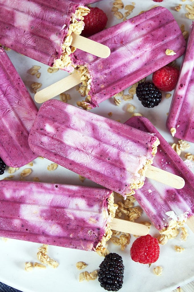 Easy to make, this Triple Berry Smoothie Breakfast Popsicles recipe are a fun way to enjoy breakfast on the go! TheSuburbanSoapbox.com @suburbansoapbox