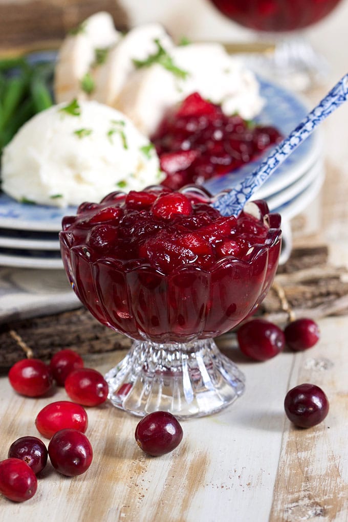 Ready in minutes, this Easy Whole Berry Cranberry Sauce recipe is simple and quick. Made with fresh berries, apples and orange...this is a Thanksgiving dinner staple! | TheSuburbanSoapbox.com