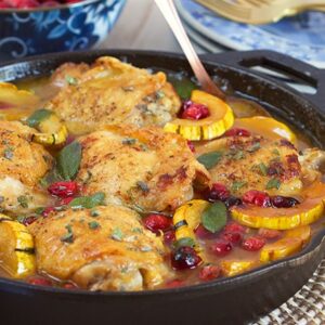 Ready in less than an hour, this one pot Maple Mustard Chicken Skillet with Cranberries and Delicata Squash is the dinner recipe your family will love. | theSuburbansoapbox.com