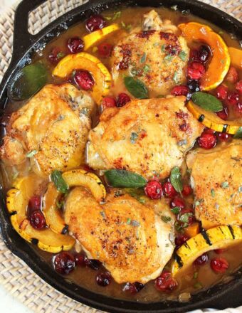 Ready in less than an hour, this one pot Maple Mustard Chicken Skillet with Cranberries and Delicata Squash is the dinner recipe your family will love. | theSuburbansoapbox.com