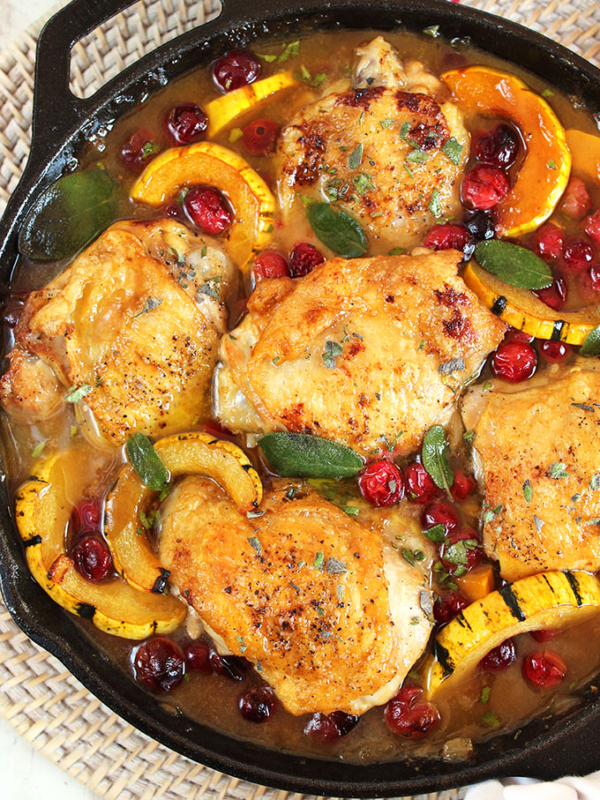 Ready in less than an hour, this one pot Maple Mustard Chicken Skillet with Cranberries and Delicata Squash is the dinner recipe your family will love. | theSuburbansoapbox.com