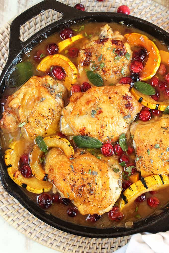 Ready in less than an hour, this one pot Maple Mustard Chicken Skillet with Cranberries and Delicata Squash is the dinner recipe your family will love. | theSuburbansoapbox.com