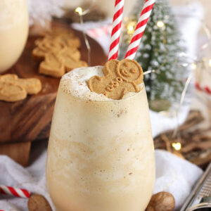 Gingerbread cheesecake smoothie with bottle brush tree in the background.