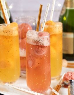 Fruity and festive, this Easy Mimosa Float Recipe is made with orange sorbet and champagne for a fun cocktail fit for any brunch celebration! | TheSuburbanSoapbox.com