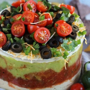 7 layer mexican dip in a glass dish.