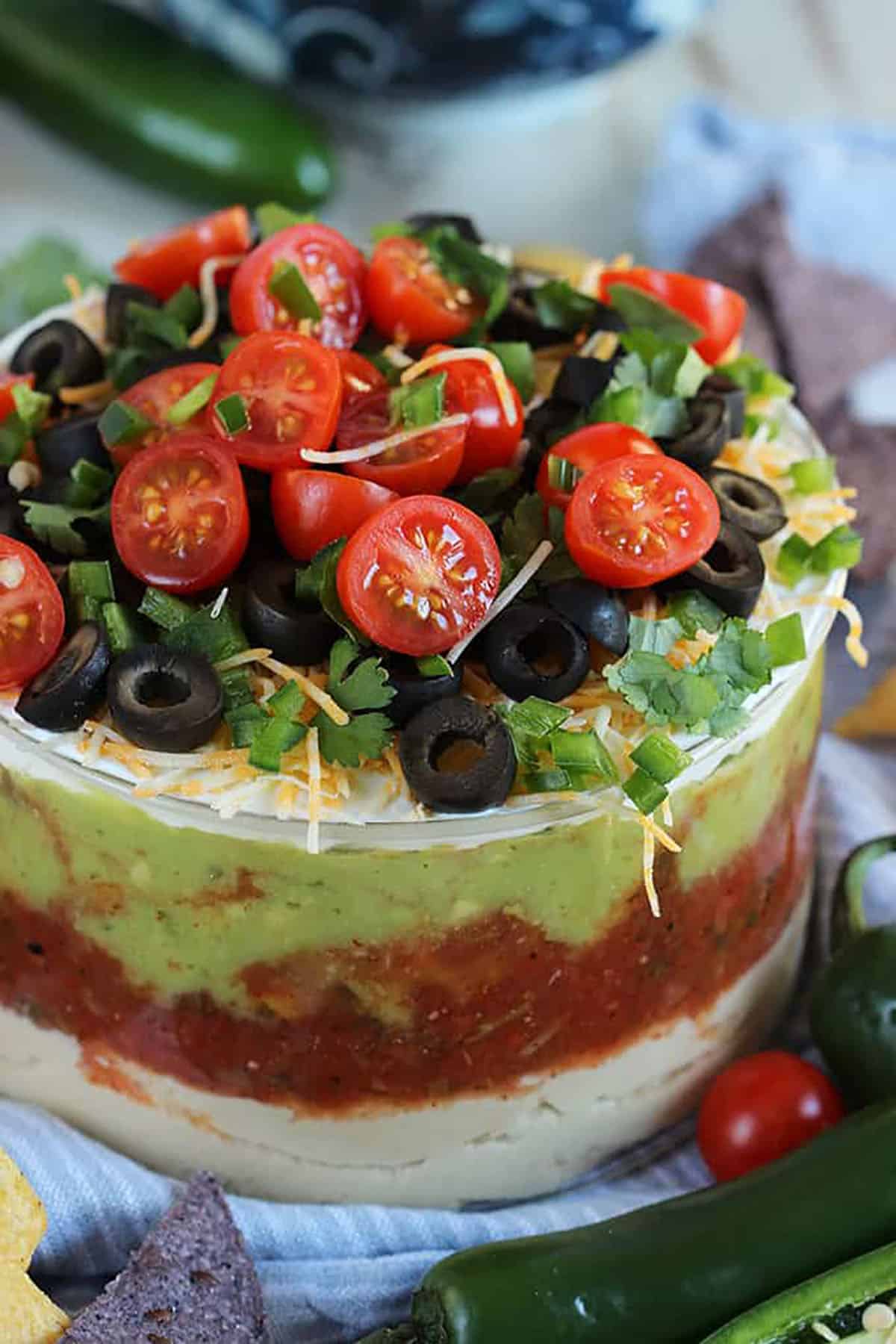 7 layer mexican dip in a glass dish.