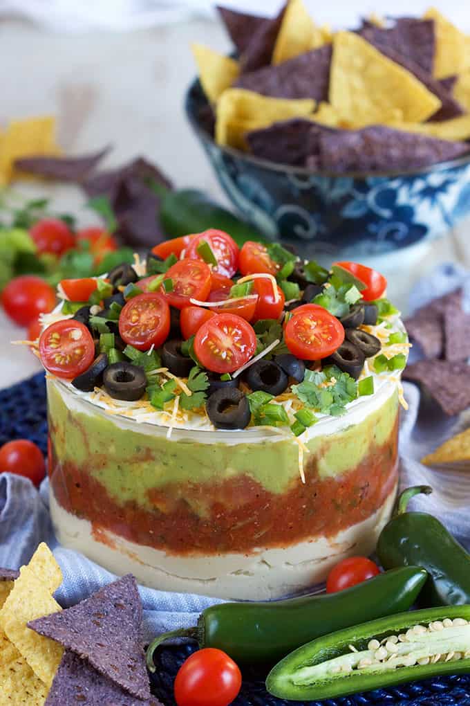 Ready in minutes, this 7 Layer Mexican Hummus Dip is the perfect addition to your game day menu! | TheSuburbanSoapbox.com