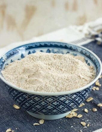 Easy to make Homemade Oat Flour in a blue and white bowl from TheSuburbanSoapbox.com