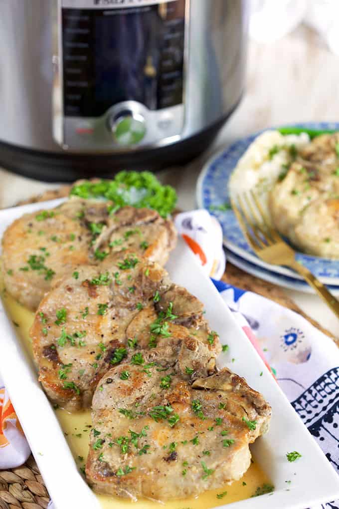 Ready in a flash, these Instant Pot Pork Chops in a Dijon Pan Sauce are a great weeknight dinner OR elegant enough for entertaining! | TheSuburbanSoapbox.com @suburbansoapbox