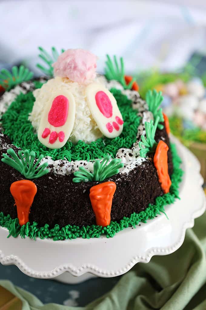 Oreo Ice Cream Cake decorated with white bunny butt with pink cotton candy tail and chocolate carrots from TheSuburbanSoapbox.com