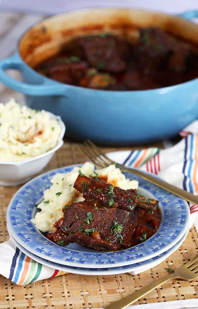 Braised Short Ribs on a blue plate with mashed potatoes | thesuburbansoapbox.com