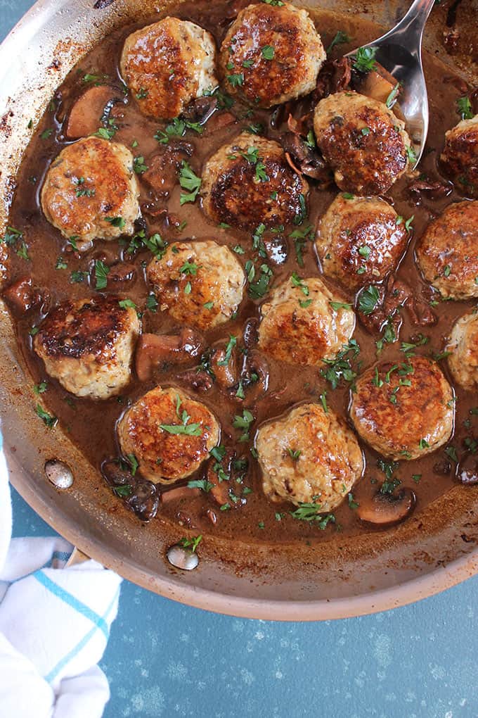 Chicken Marsala Meatballs with mushrooms in a stainless steel skillet from TheSuburbanSoapbox.com