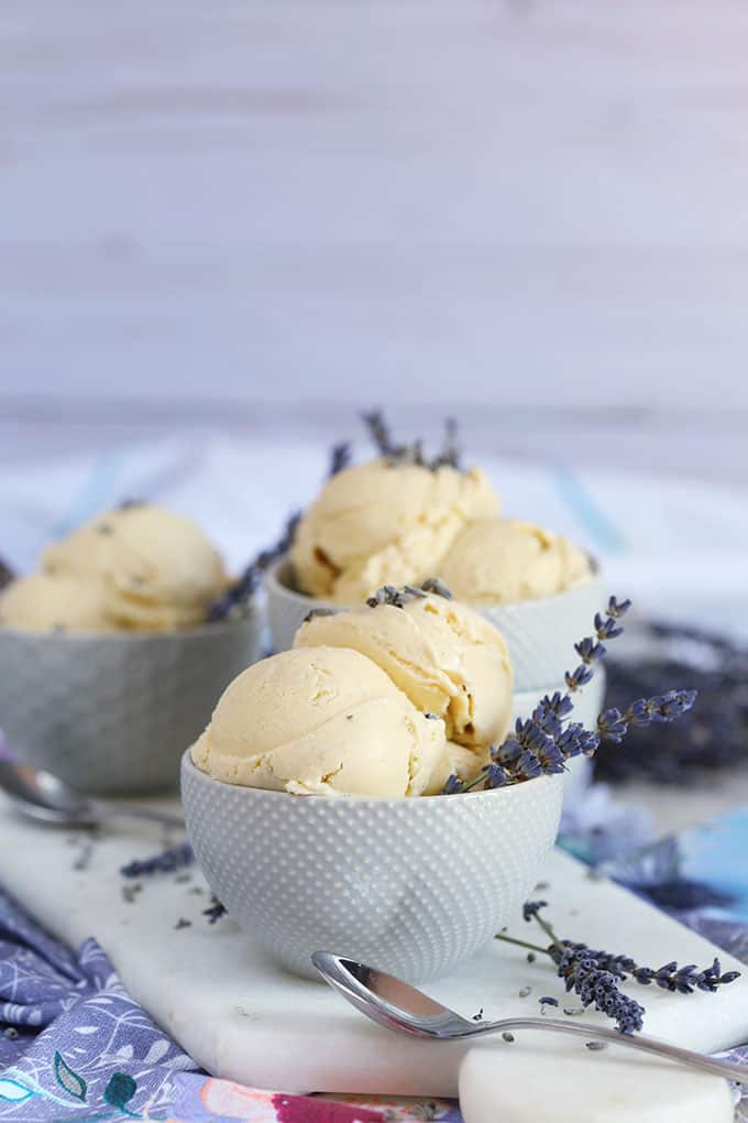 Lavender Vanilla Ice Cream recipe in a gray bowl on a marble board from TheSuburbansoapbox.com