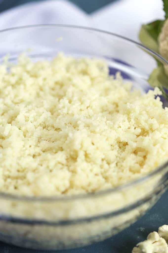 Close up shot of cauliflower rice in a glass bowl from TheSuburbanSoapbox.com