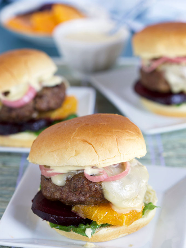 Lamb Burger on a Brioche Roll on a blue background from TheSuburbanSoapbox.com