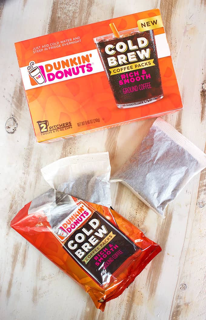 Dunkin Donuts Cold Brew packets on a white wood background from TheSuburbanSoapbox.com