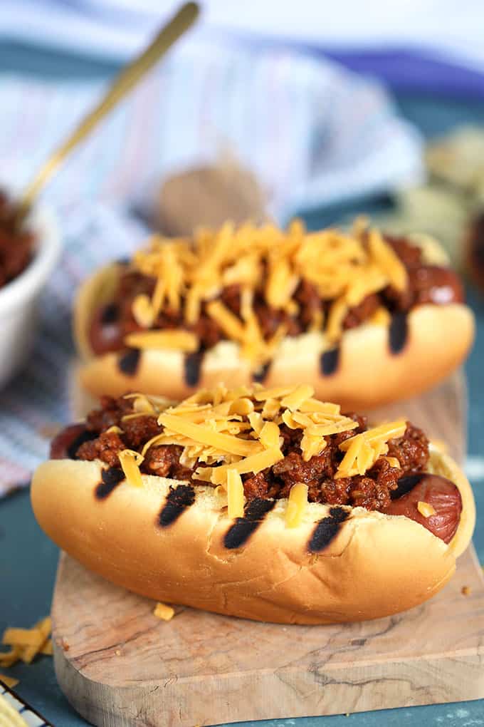 Chili Cheese Dogs on a wooden board from TheSuburbansoapbox.com