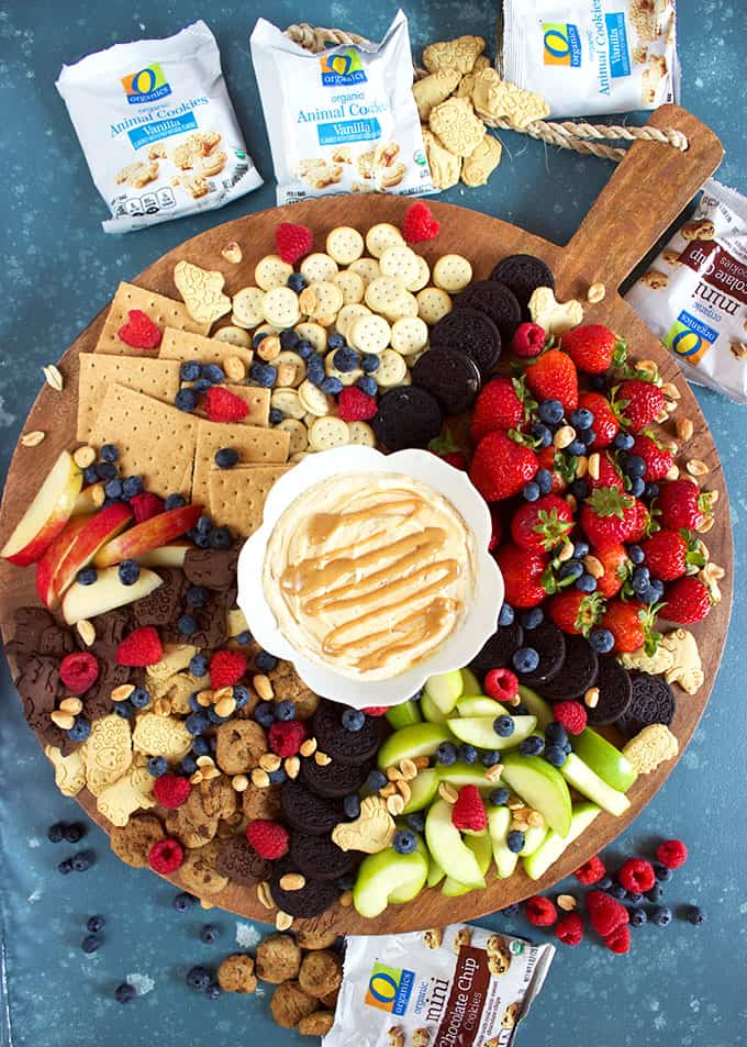 Overhead shot of fruit and cookie charcuterie tray with fluffernutter dip in a white bowl from TheSuburbanSoapbox.com