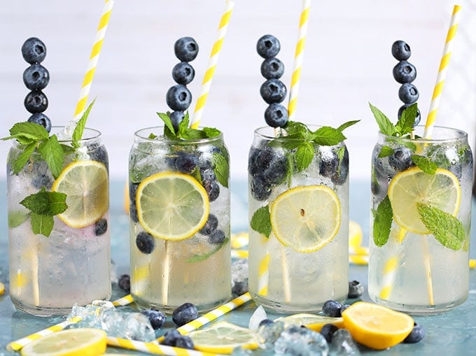 Lemonade Gin Mojito with blueberries in a glass.