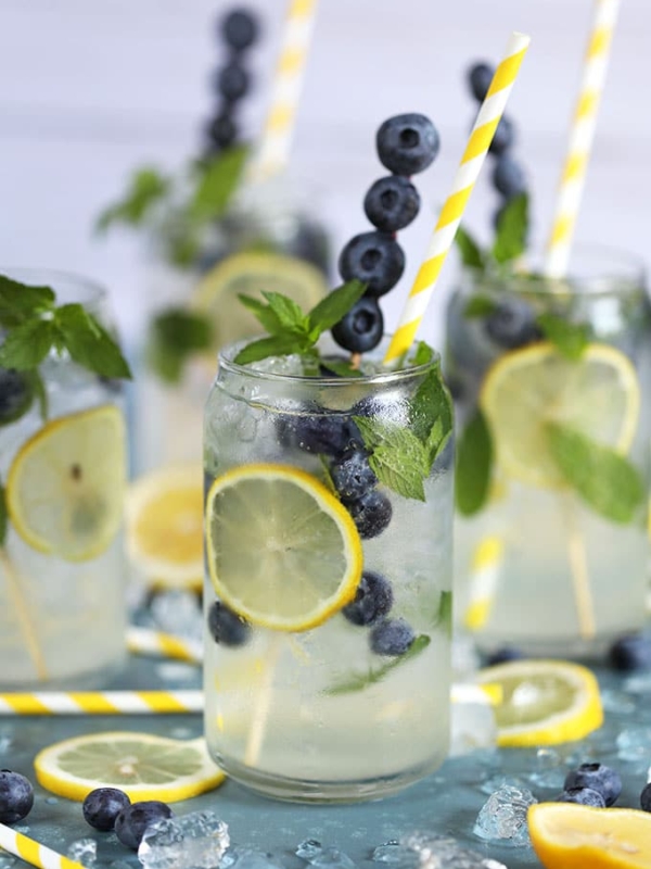 Lemonade Gin Mojito Cocktail on a blue background from TheSuburbanSoapbo