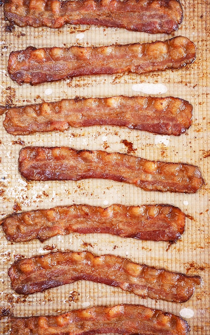 Oven Baked Bacon on a baking sheet with parchment paper.