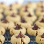 Peanut Butter Blossom cookies on a cooling rack.