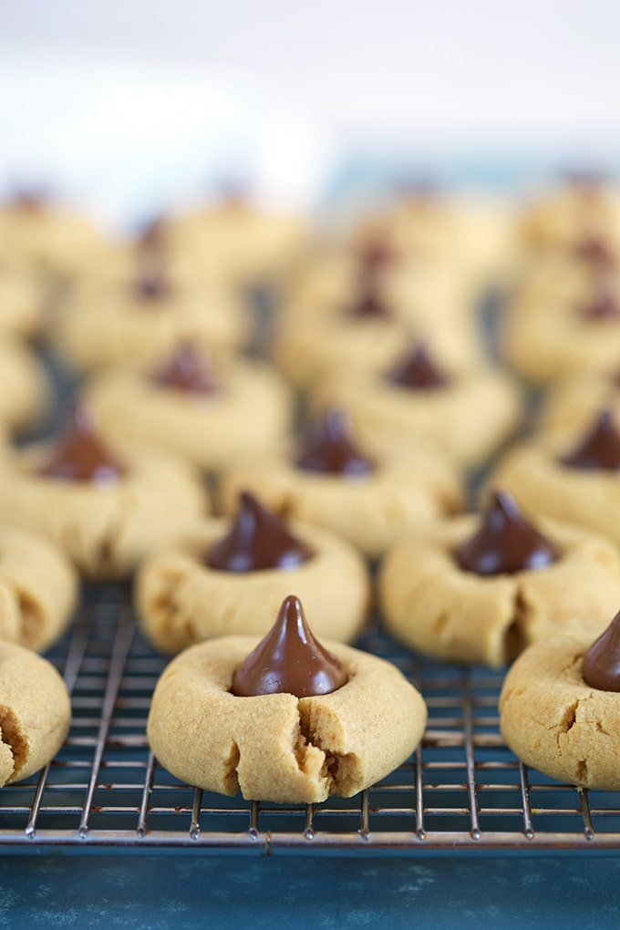 Peanut Butter Blossom cookies on a cooling rack.