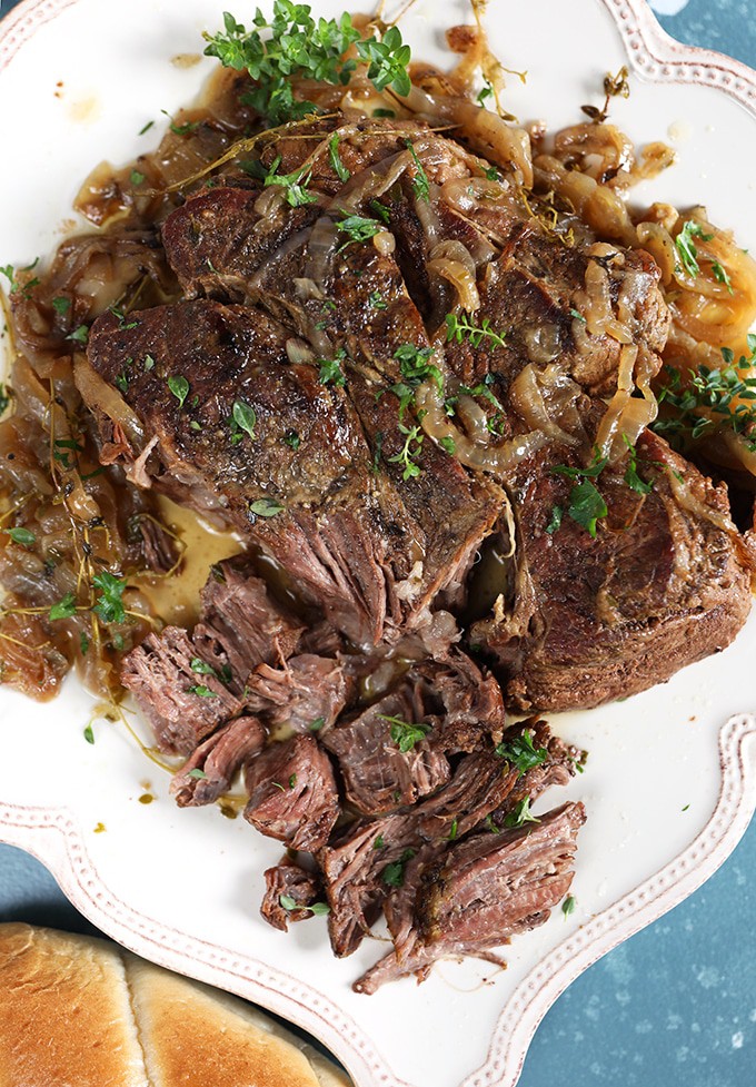 Beef on a white platter for French Dip sandwiches.