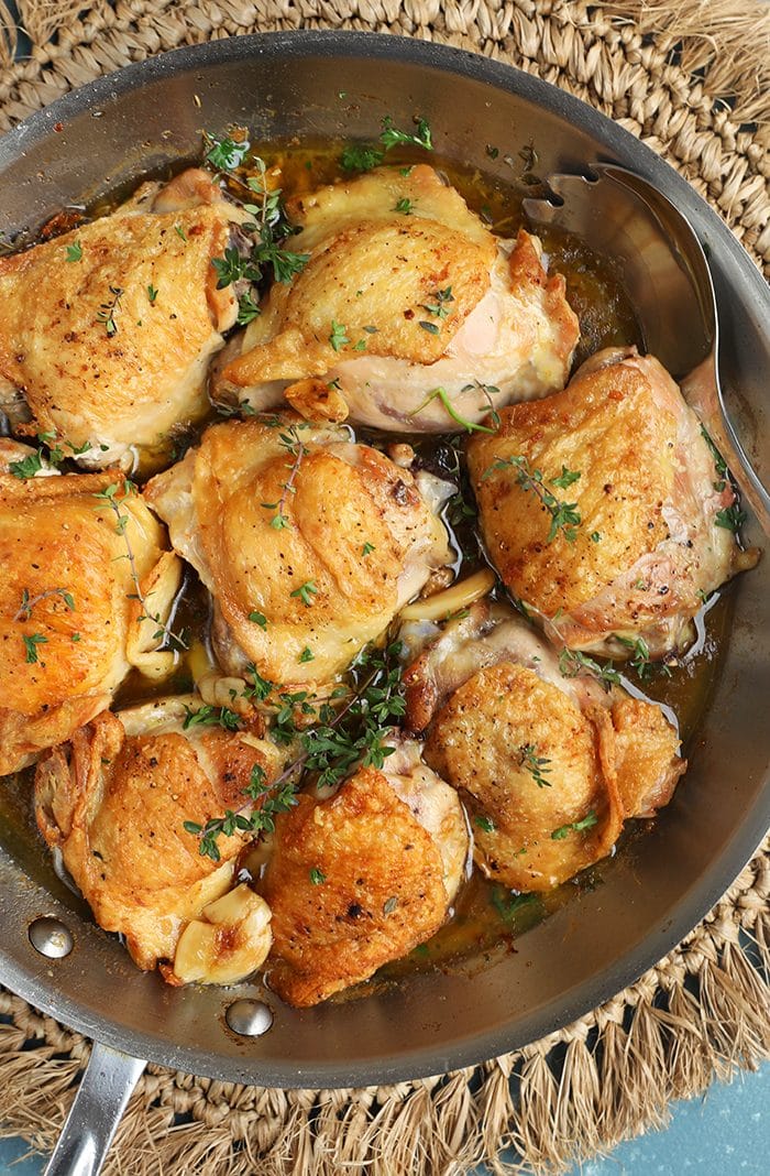 Overhead shot of Crispy Baked Chicken Thighs in a skillet.