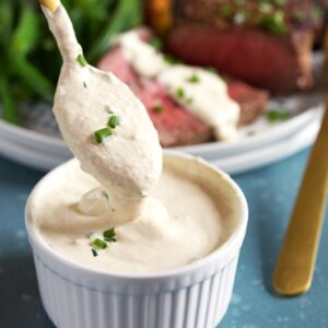 Spoon in a bowl of horseradish sauce.