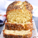 Everything Bagel Brioche on a marble board with two slices cut off and stacked in front.