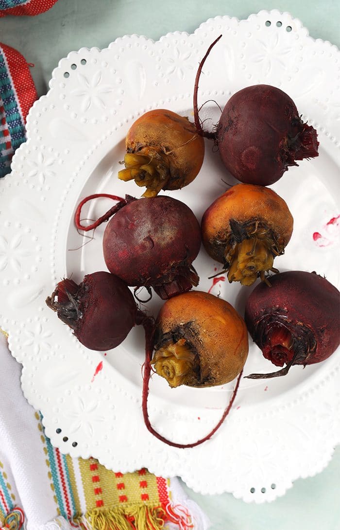 Cooked beets on a white plate.