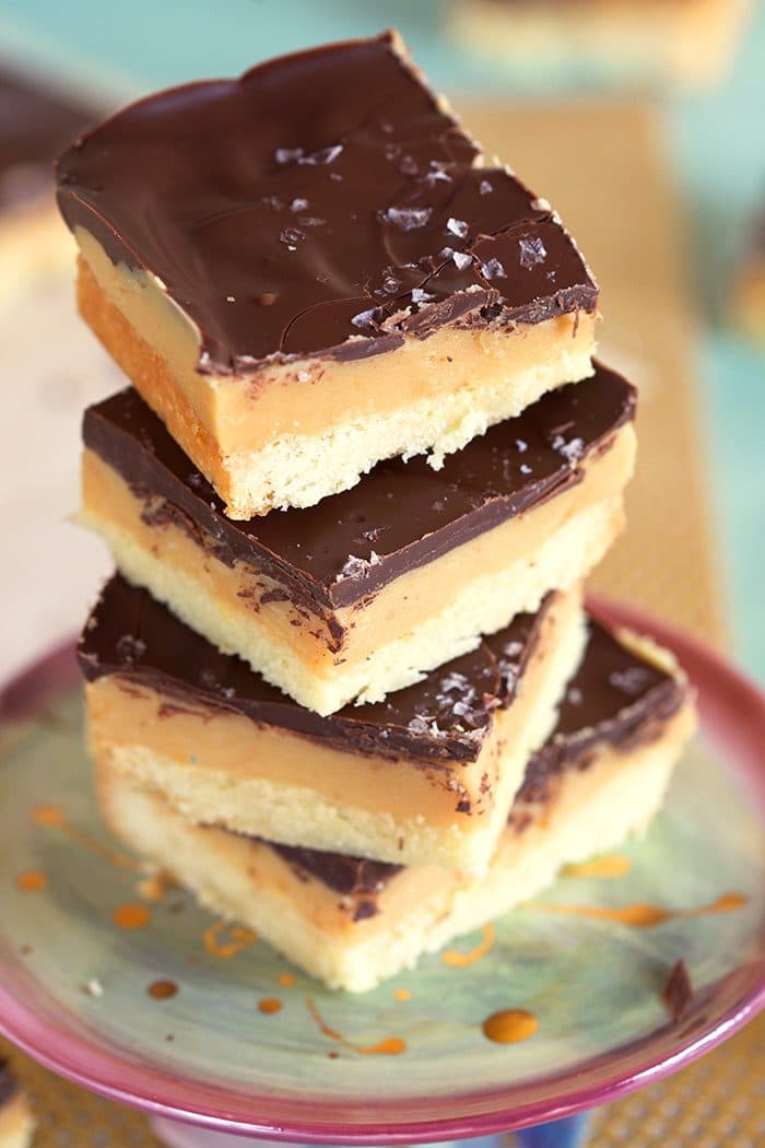 Close up of Millionaire Shortbread Bars on a cake plate.