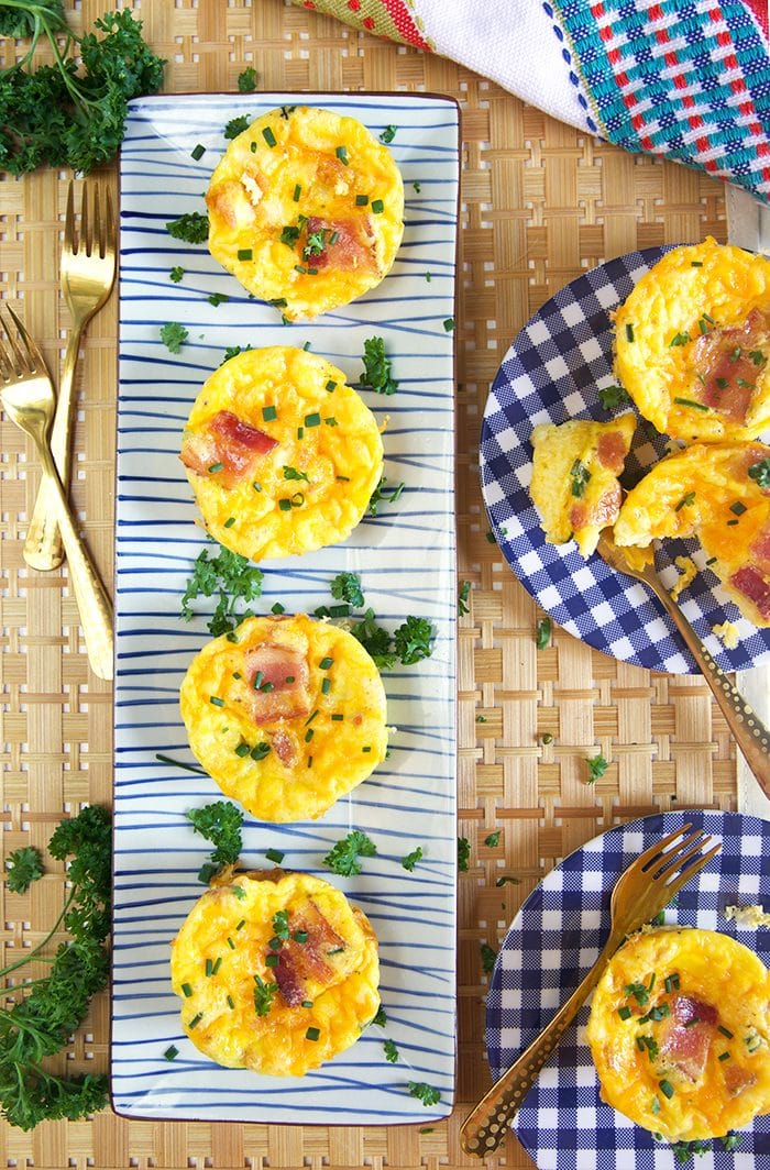Overhead shot of egg muffin cups on a rectangle platter.