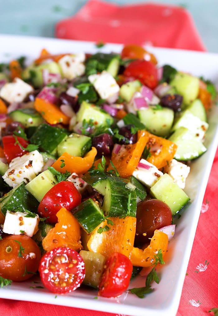 Close up of Greek Salad on a white platter.
