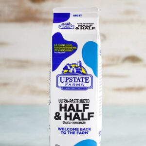 Carton of Half and Half on a blue background.