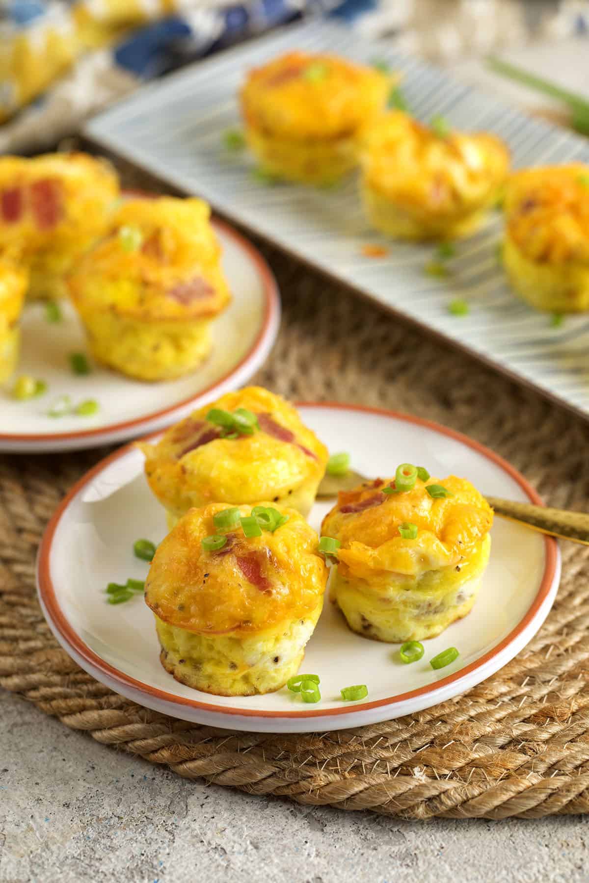 Cheddar bacon egg bites on plates