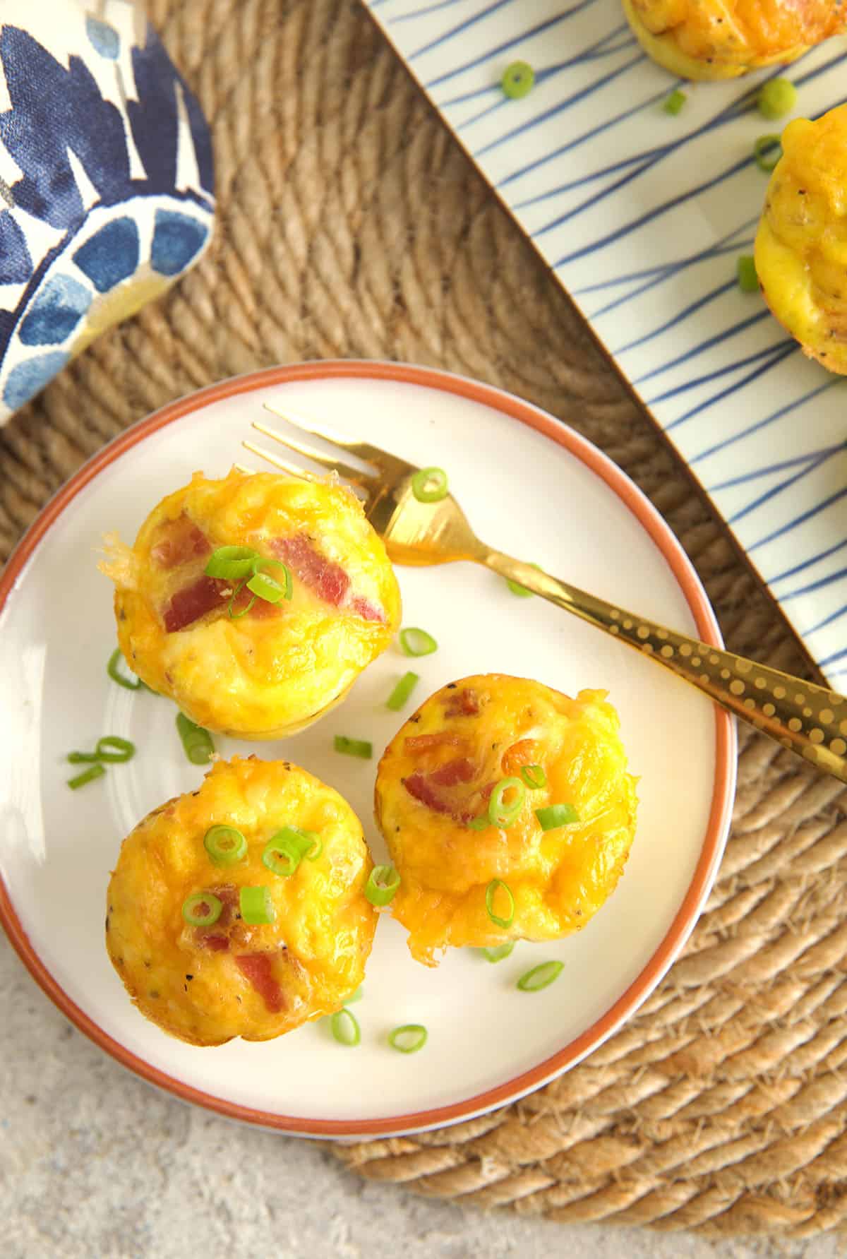 Overhead view of bacon cheddar egg bites on plate