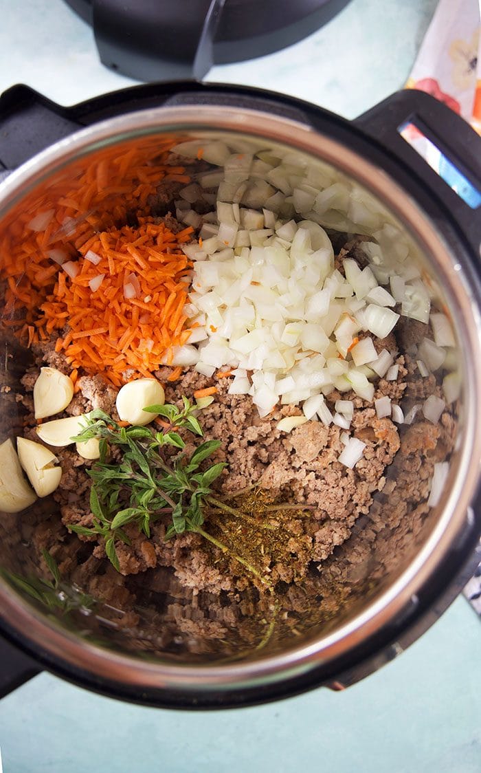 Overhead shot of Bolognese Sauce ingredients in an Instant Pot.