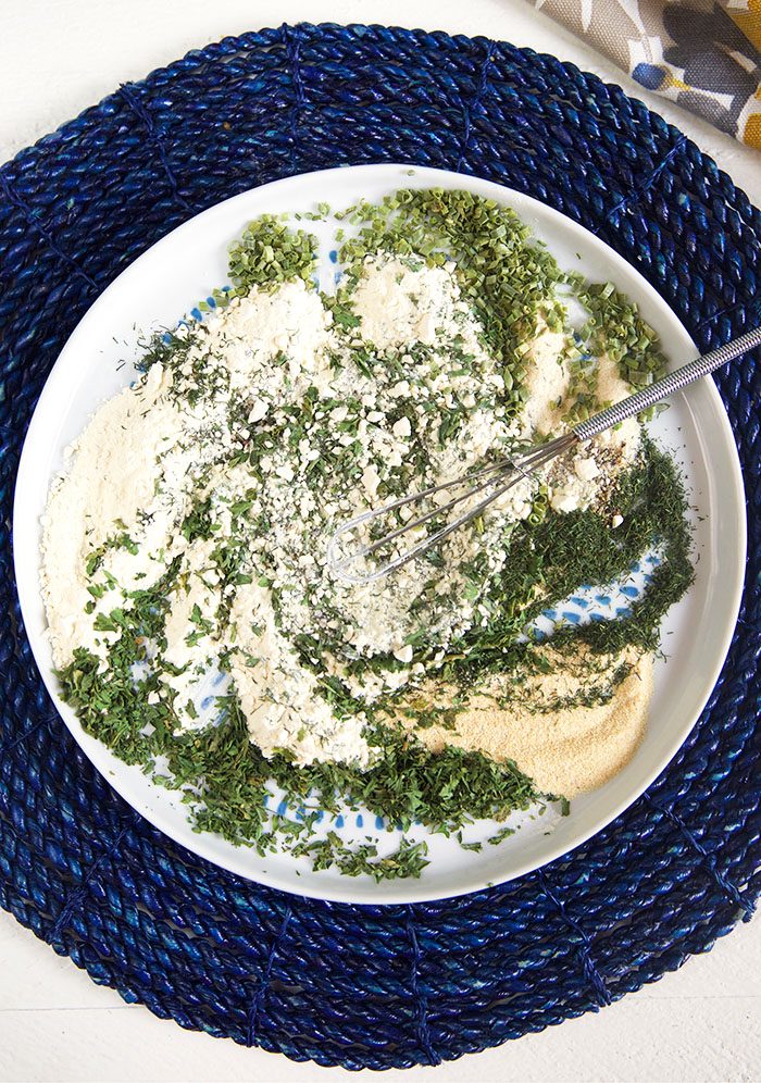 Ranch seasoning mix on a plate that's been whisked together.