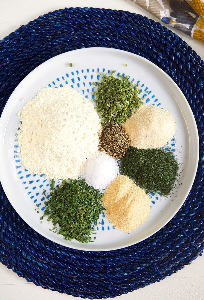 Overhead shot of ranch seasoning ingredients on a round plate.