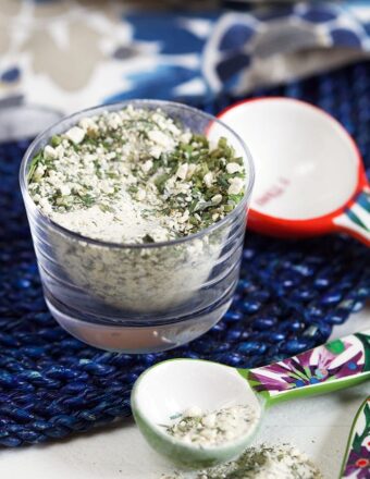 Ranch Seasoning in a glass dish on a blue placemat.
